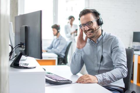 Male employee attending an online group learning session